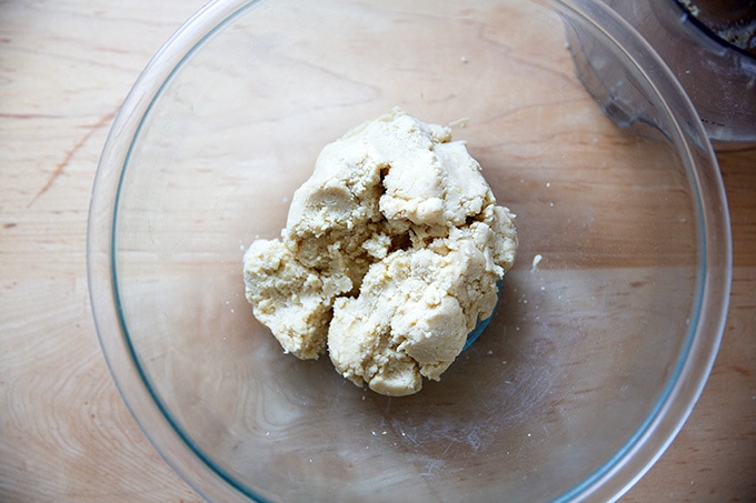 A bowl of lemon-almond snowball cookie dough. 