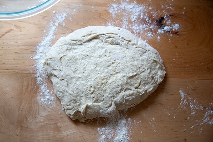 Pretzel roll dough on a lightly floured counter top.