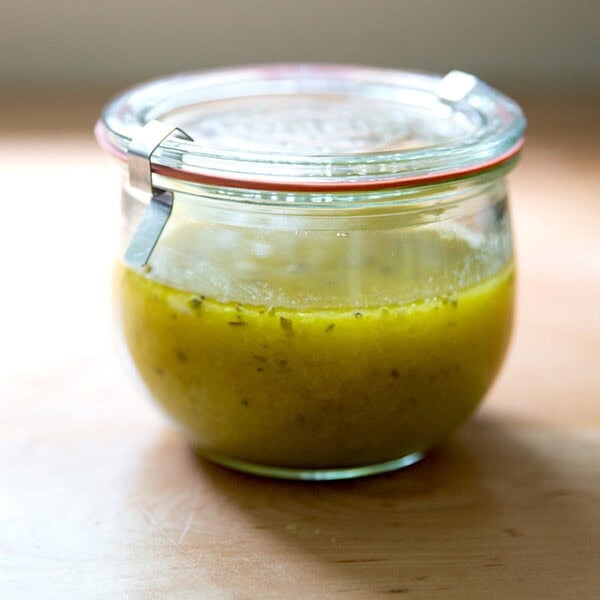 A Weck jar filled with Italian dressing.