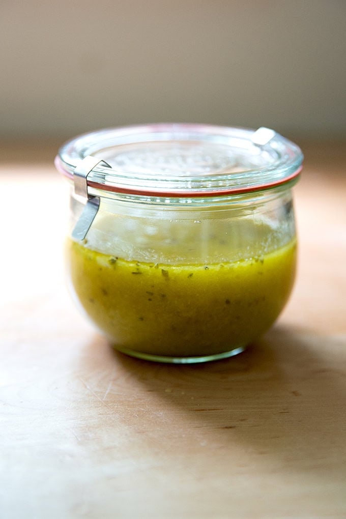 A Weck jar filled with Italian dressing.