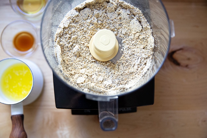 Dry ingredients blitzed for no-bake granola bars in a food processor.