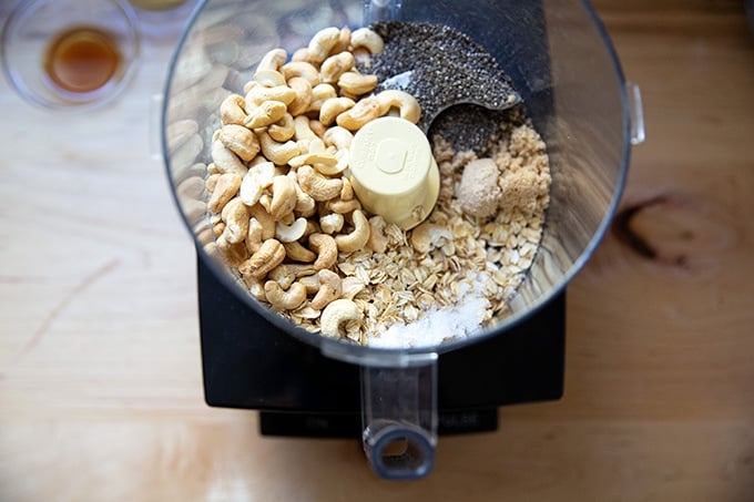 Dry ingredients for no-bake granola bars in a food processor.
