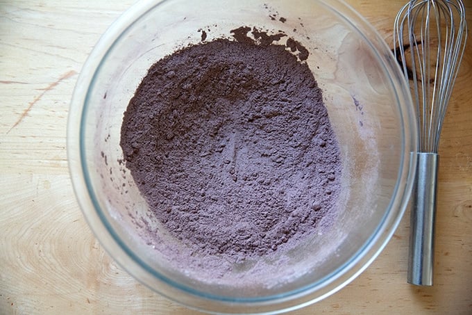 A bowl filled with the whisked together dry ingredients to make brownies.