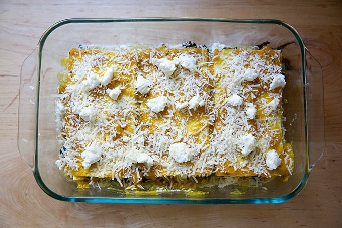 Top layer of cheese in a vegetable lasagna in a baking dish.