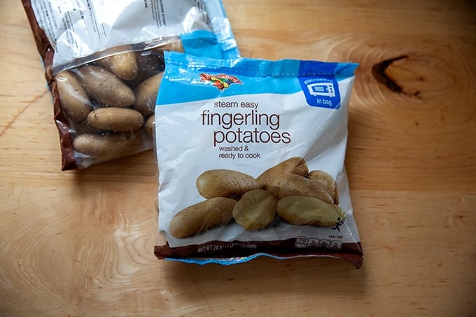 A bag of fingerling potatoes on a countertop.