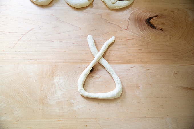 Pretzel dough partly shaped into a pretzel.