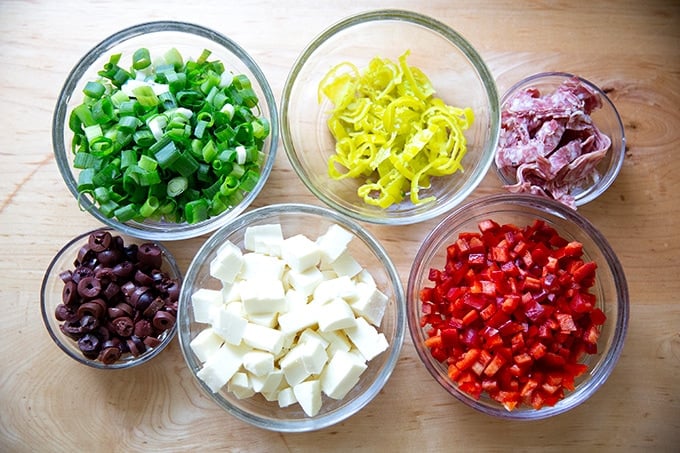 The add-ins of a deli-style pasta salad.