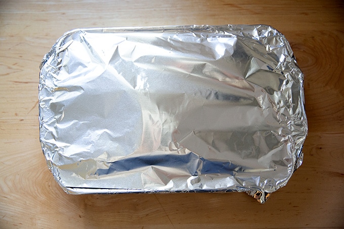 A 9x13-inch baking dish covered in foil.