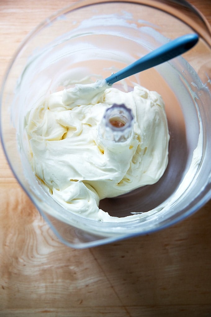 Beaten whipped cream - cream cheese frosting in a stand mixer.