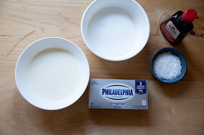 Ingredients to make whipped cream-cream cheese frosting.