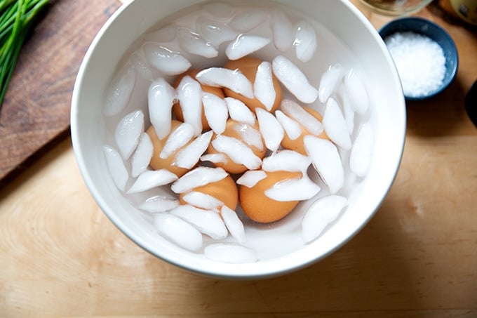 An ice bath filled with hard-cooked eggs.