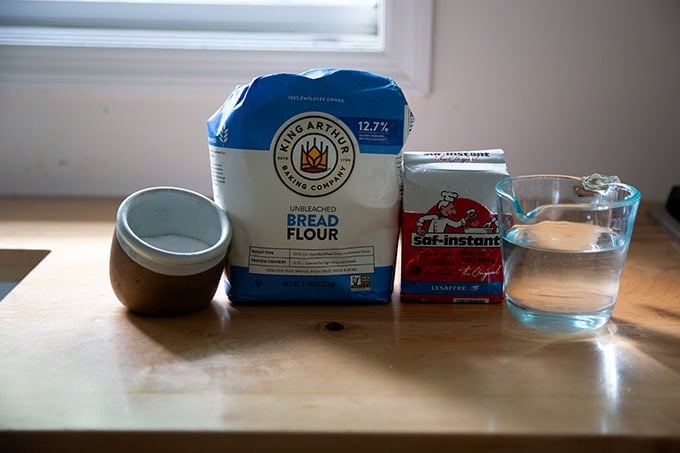 Ingredients to make baguettes on a countertop.