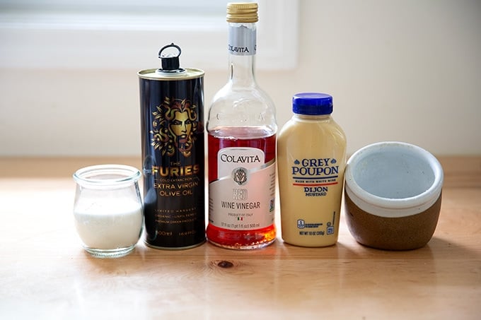 Ingredients to make Greek salad dressing on a countertop.