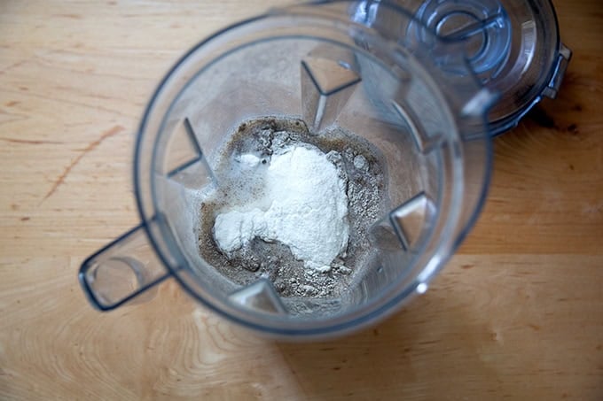 A blender filled with the ingredients to make buckwheat crepes.