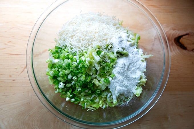 Ingredients to make cabbage tortilla batter in a bowl, unmixed.