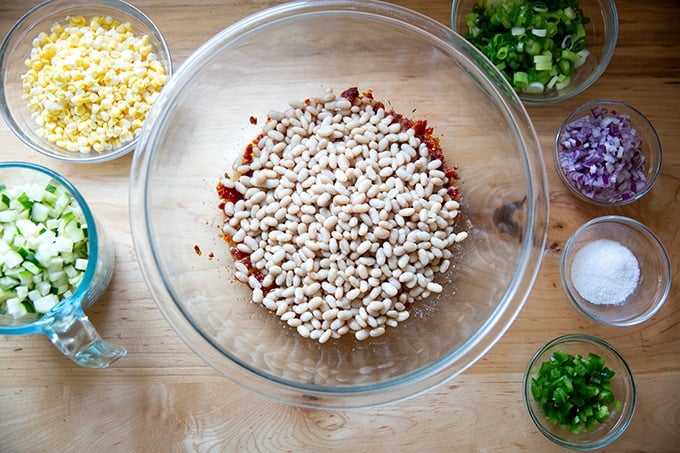 Ingredients to make bean salad on a countertop.