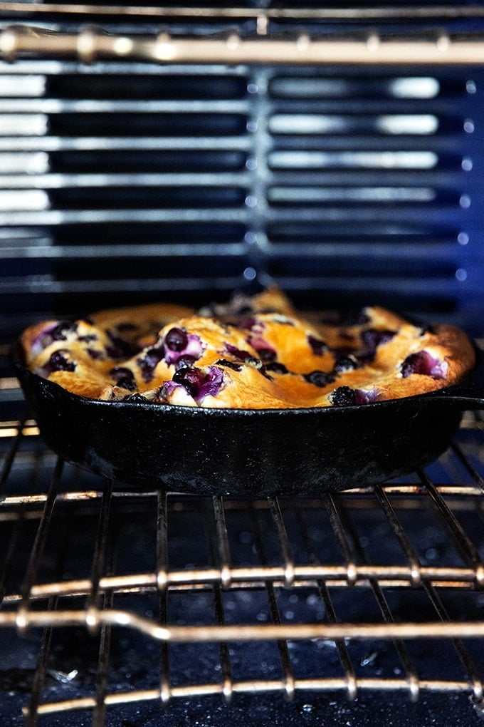 Blueberry Dutch baby in the oven.
