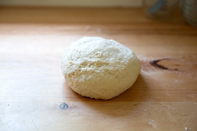 Kneaded soft pretzel dough on the counter top.
