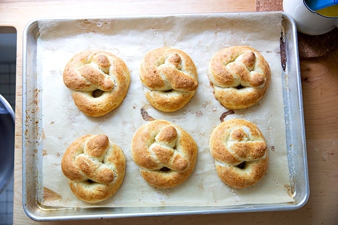 Baked, lower-sugar soft pretzels on a sheet pan.