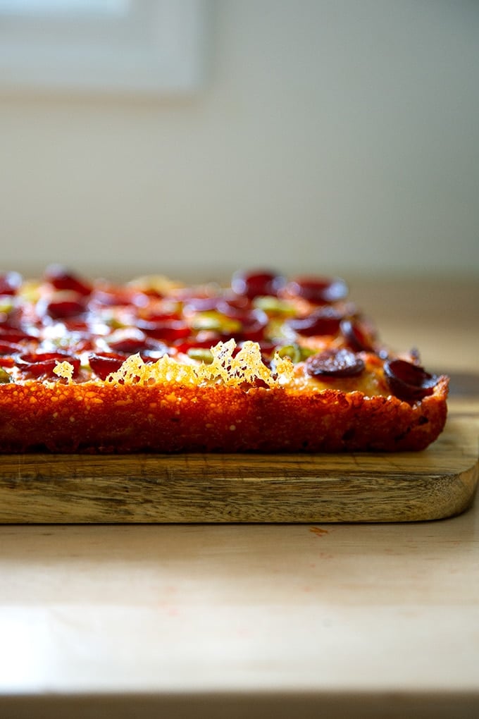Just baked Detroit-style pizza with a frico crust.