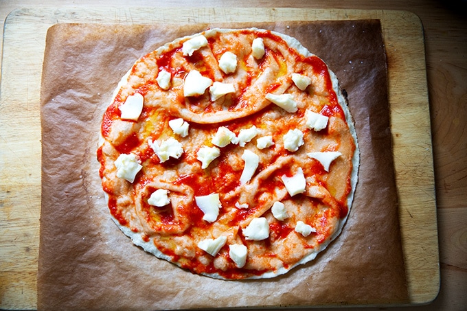 A gluten-free Margherita pizza ready for the oven.