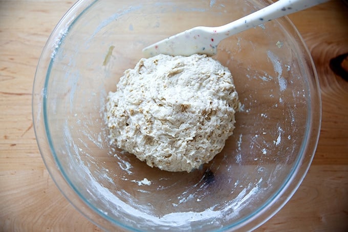Mixed oatmeal maple bread dough in a bowl.