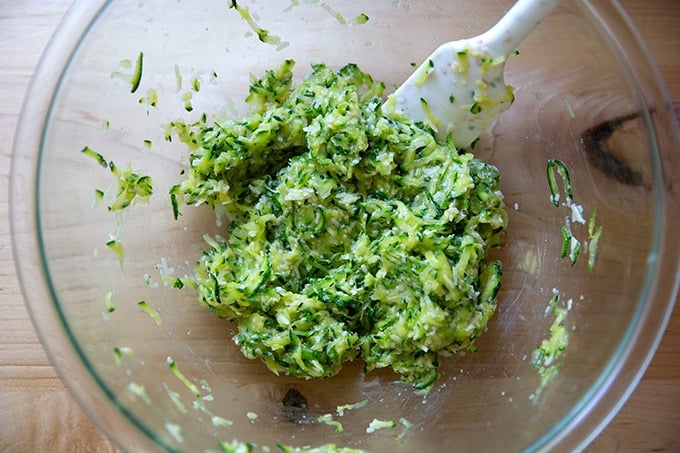 Zucchini tortilla batter mixed in a large bowl.