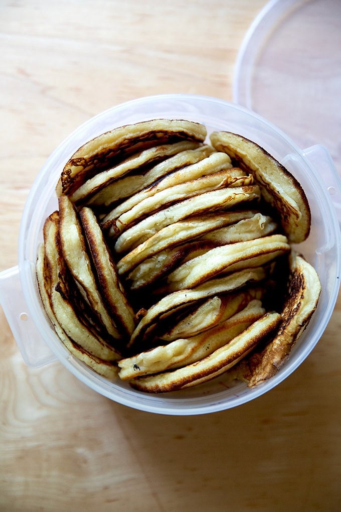 A large container filled with sourdough discard pancakes.