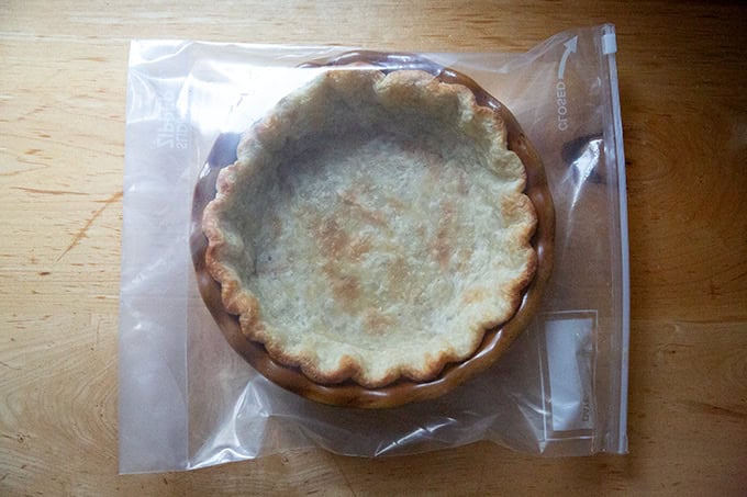 A parbaked pie crust in a ziptop bag. - 16