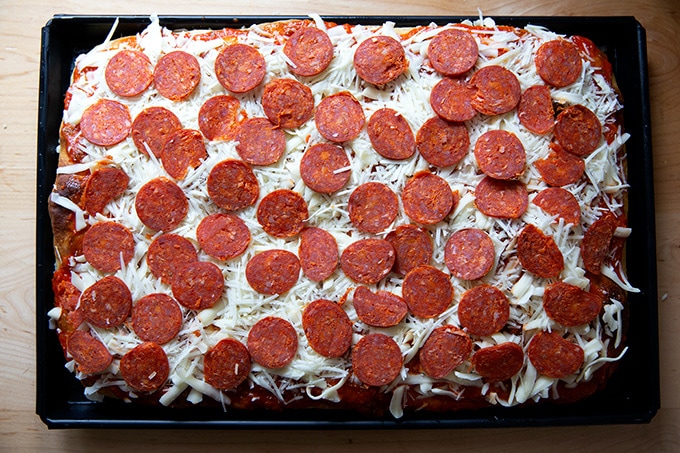 A pan of Sicilian-style pizza ready for the oven.