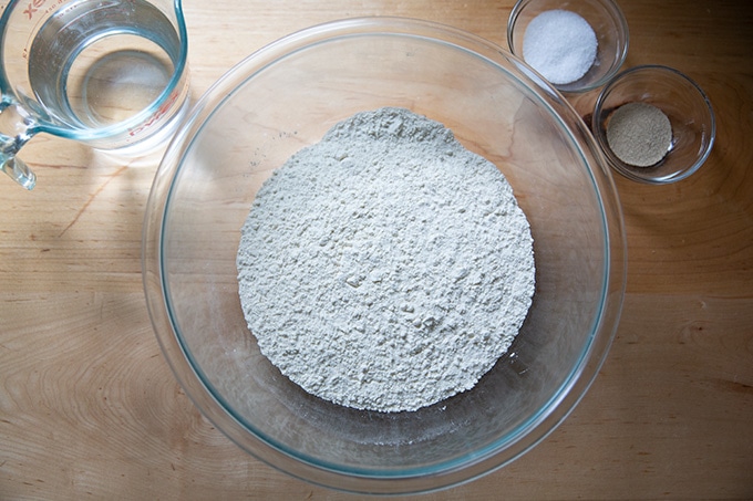 Ingredients to make pizza: flour, water, salt, yeast.