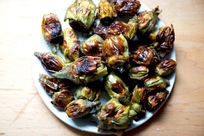 A plate of crispy baby artichokes. - 10