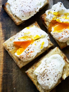 Four poached eggs on toast.
