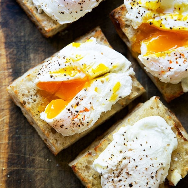 Four poached eggs on toast.