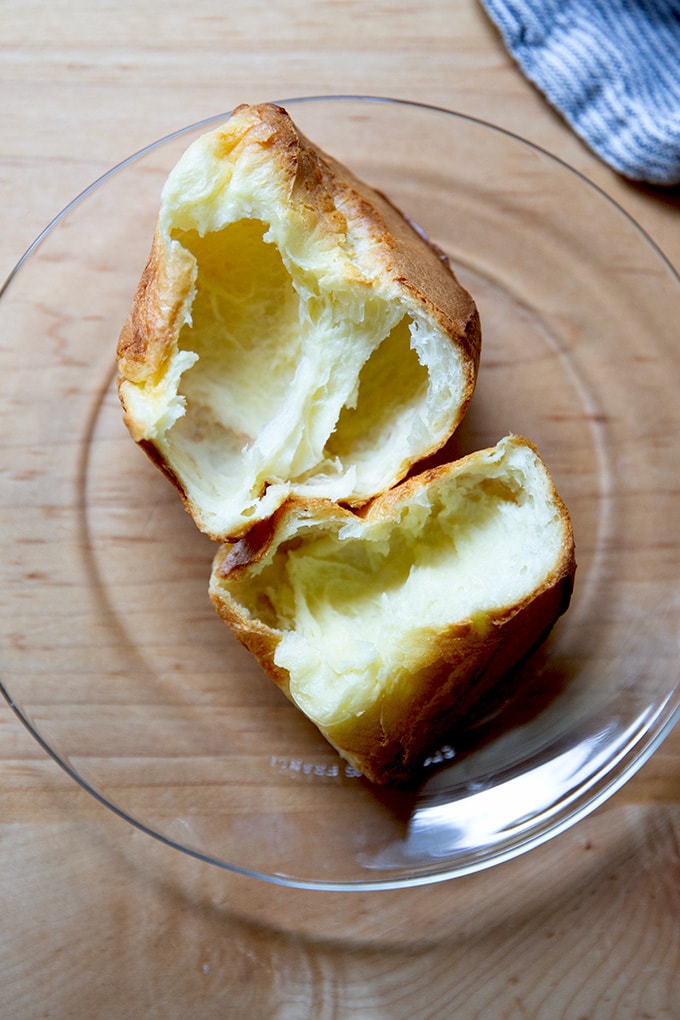A halved popover on a plate.