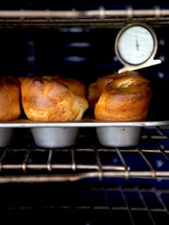 A tray of popovers in the oven.