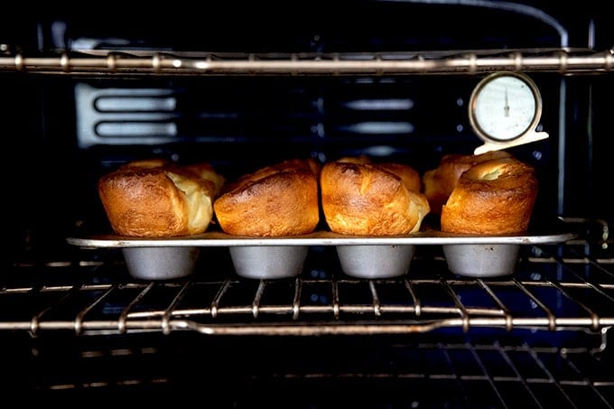 A tray of popovers in the oven.