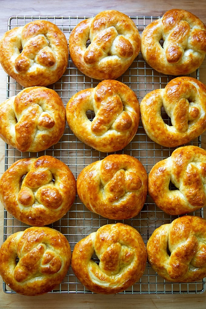 Just-baked soft pretzels on a cooling rack.