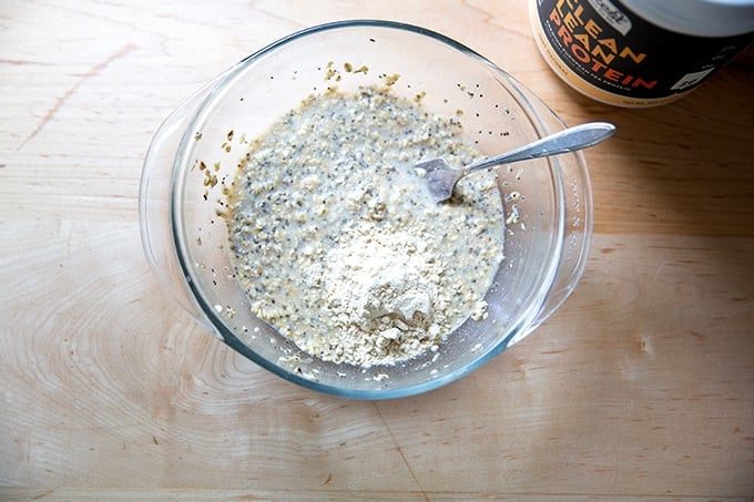A scoop of protein powder in the banana-oat pancake batter.