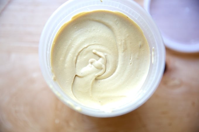 A quart of creamy hummus.