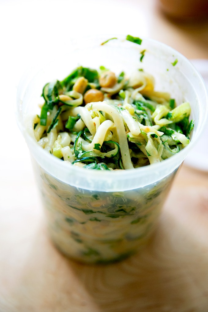 A quart container filled with peanut noodles.