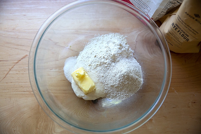 Ingredients to make sourdough crackers in a bowl.