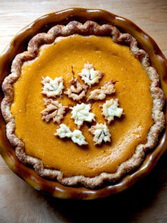 A butternut squash pie decorated with pie dough cookies.