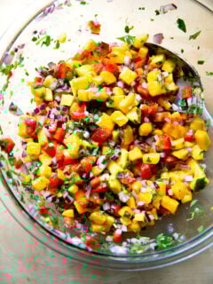 A large bowl of mango salsa.