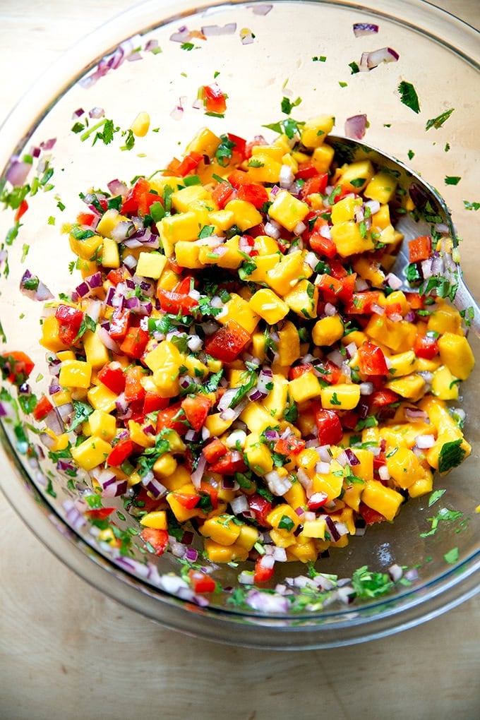 A large bowl of mango salsa. - 21
