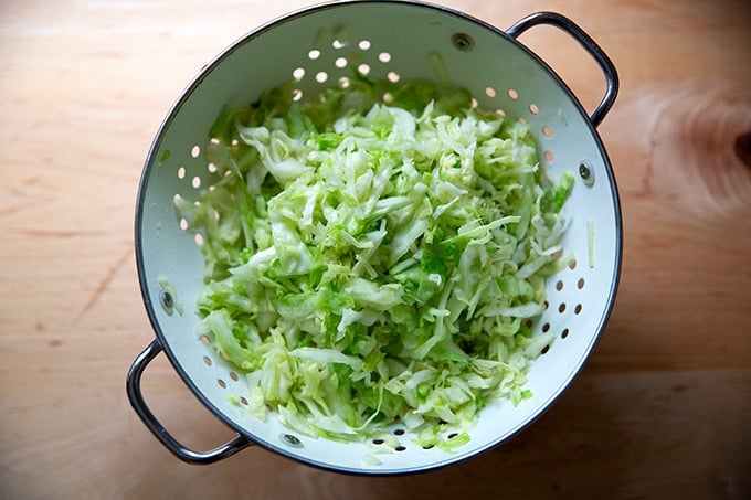 Salted cabbage in a colander after 15 minutes.