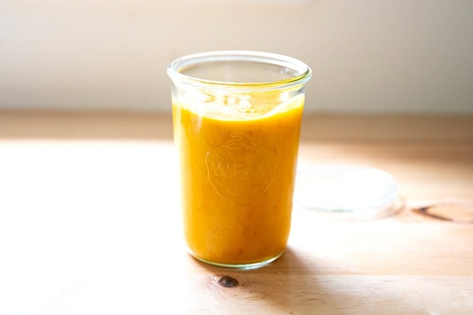 A jar of roasted yellow tomato sauce.