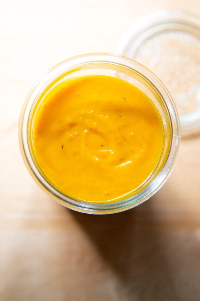 A jar of roasted yellow tomato sauce.