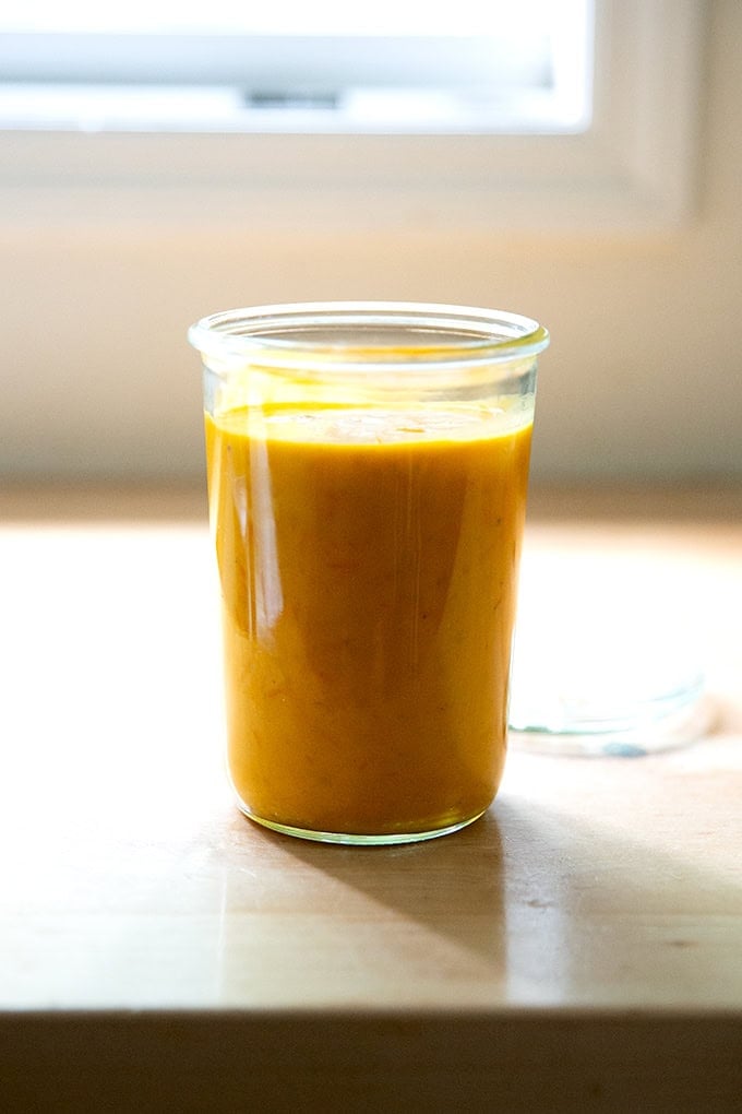 A jar of roasted yellow tomato sauce.