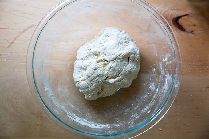 Baguette dough just mixed into a shaggy mass in a large bowl.